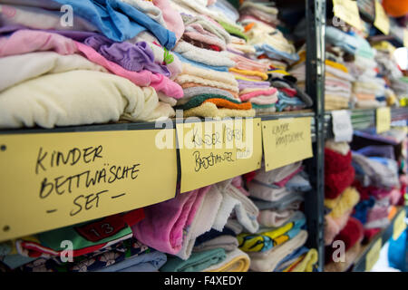 Duesseldorf, Germany. 22nd Oct, 2015. Assorted children's clothing is seen in the clothing storage room of a refugee shelter in Duesseldorf, Germany, 22 October 2015. Photo: Monika Skolimowska/dpa/Alamy Live News Stock Photo