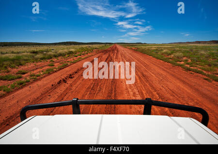 Red desert track in Central Australia. Stock Photo