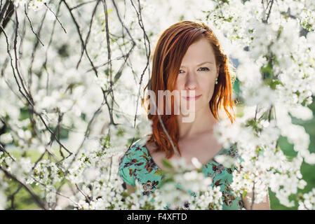 Young woman doing yoga in Park Stock Photo