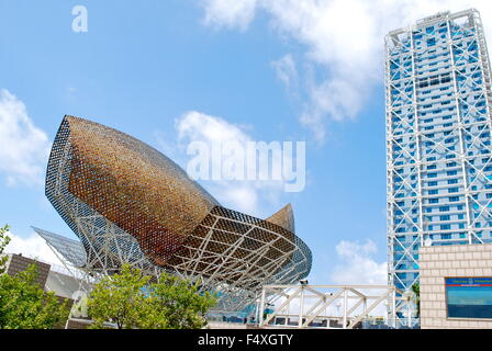 Steel arch golden copper Fish sculpture by Frank Gehry at Port Olympic in Barcelona, Spain. Stock Photo