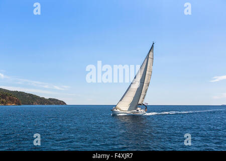 Sailing ship yachts with white sails in the Mediterranean Sea. Stock Photo