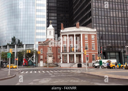 church of our lady of the rosary in downtown manhattan with skyscrapers in the background and yellow cab Stock Photo