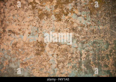 grunge background: exterior wall weathered with concrete, mortar and graffiti Stock Photo