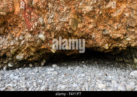 Cave entrance on the beach at Bullslaughter bay in Pembrokeshire, Wales. Stock Photo