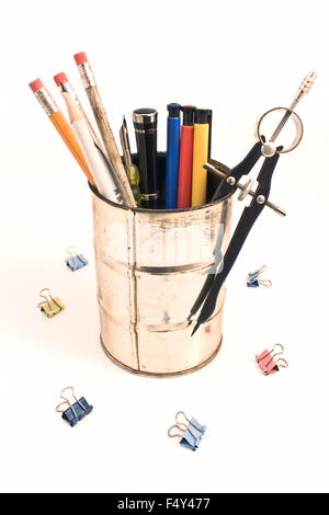 Pencils and pens in a tin holder isolated on white Stock Photo