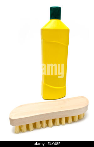 Wooden scrub brush with bottle of cleaning liquid isolated on white Stock Photo