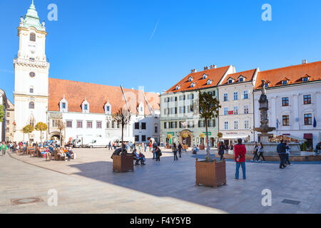 BRATISLAVA, SLOVAKIA - SEPTEMBER 22, 2015: tourists at Main Square (Hlavne namestie) and view of old Town Hall in Bratislava cit Stock Photo