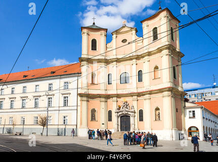 BRATISLAVA, SLOVAKIA - SEPTEMBER 23, 2015: tourist near Trinitarian Church or Trinity Church (Church of Saint John of Matha and Stock Photo