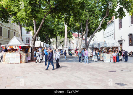 BRATISLAVA, SLOVAKIA - SEPTEMBER 23, 2015: people on souvenir market at Frantiskanske namestie (Franciscan Square). Its name is Stock Photo