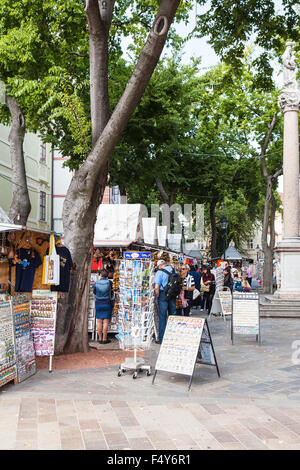 BRATISLAVA, SLOVAKIA - SEPTEMBER 23, 2015: tourists near kiosks at Frantiskanske namestie (Franciscan Square). Its name is deriv Stock Photo