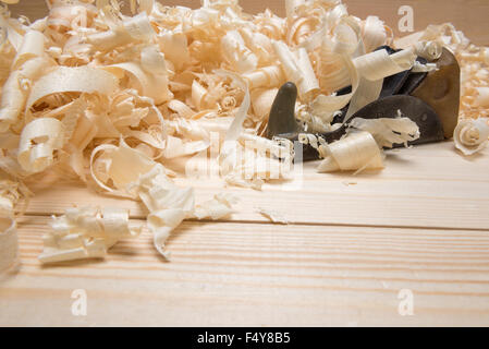 Hand jointer and shavings on pine boards Stock Photo