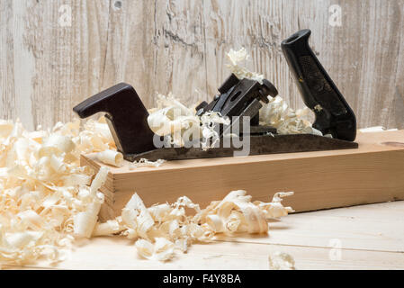 Hand jointer and shavings on pine boards Stock Photo