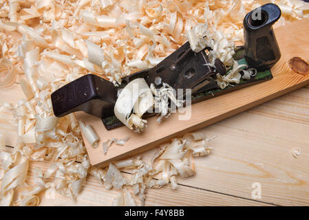 Hand jointer and shavings on pine boards Stock Photo