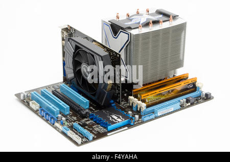 ASUS motherboard with Arctic Cooler Freezer Xtreme CPU cooler, Team Vulcan DDR3 memory sticks, and ASUS graphics card in situ. Stock Photo