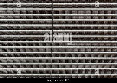 shut slatted closed modern venetian or roman blind from several thin metal slats Stock Photo