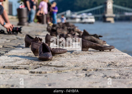 Shoes symbolizing the massacre of people shot at the river Danube in Budapest Stock Photo