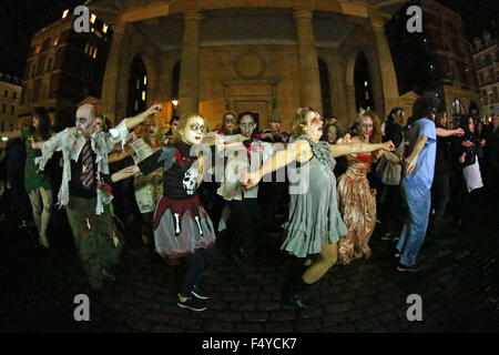 London, UK. 24th October 2015. Participants dressed as Zombies at the Thrill the World Zombie Flash Mob, Covent Garden, London which is an annual worldwide event to try and break the record for the most number of people dancing simultaneously to Michael Jackson's Thriller. It also raises money for humanitarian and charitable causes. Credit:  Paul Brown/Alamy Live News Stock Photo
