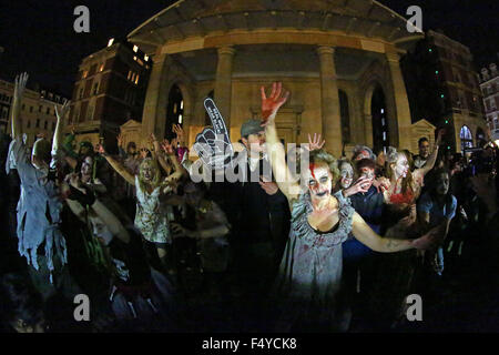 London, UK. 24th October 2015. Participants dressed as Zombies at the Thrill the World Zombie Flash Mob, Covent Garden, London which is an annual worldwide event to try and break the record for the most number of people dancing simultaneously to Michael Jackson's Thriller. It also raises money for humanitarian and charitable causes. Credit:  Paul Brown/Alamy Live News Stock Photo