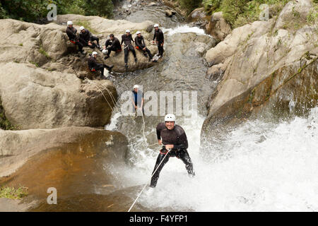 Adult Man Descending An Ecuadorian Waterfall In A Correct Position Stock Photo