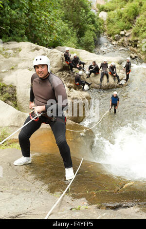 Adult Man Descending An Ecuadorian Waterfall In A Correct Position Stock Photo