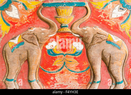 Carved Thai of elephant on the wood. Public object full scale Stock Photo