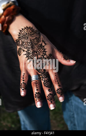 Henna tattoo on woman's hand trendy floral design Stock Photo
