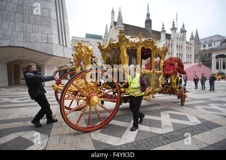 London, UK. 24th Oct, 2015. The Lord Mayor's state coach is taken from the Museum of London for its journey to the Guildhall.  Over the weekend the traffic is stopped outside the Museum of London as The Lord Mayor's state coach - built in 1757, one of the oldest in the world still in use is moved on a short journey by police escort to the the Guildhall in the heart of the City of London ahead of The Lord Mayor's Show 2015 on November 14th which marks its 800th birthday. Credit:  Clickpics/Alamy Live News Stock Photo