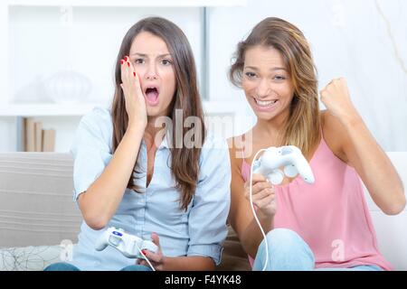 Two girls playing computer game Stock Photo