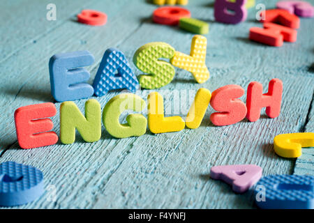 English is easy to learning concept with letters on blue boards concept Stock Photo