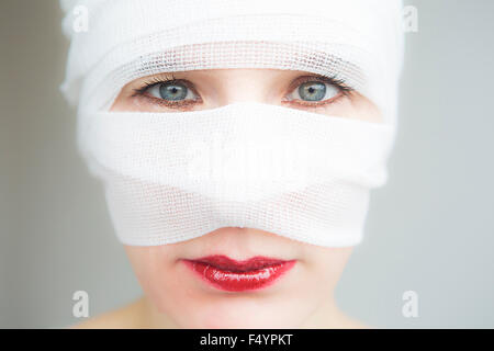 closeup of woman wrapped in bandages with beautiful eyes Stock Photo