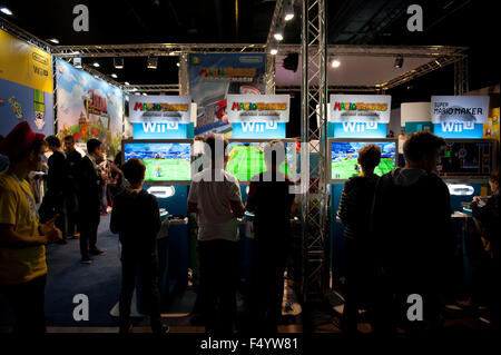 Warsaw, Poland. 24th Oct, 2015. Trade fair show games expo stands, children playing Mario Tennis games at Warsaw Games Week, Targi Gier Wideo, Hala Expo XXI, Warsaw, Poland, October 24, 2015, horizontal orientation, rights managed, editorial use only. Credit:  Arletta Cwalina/Alamy Live News Stock Photo