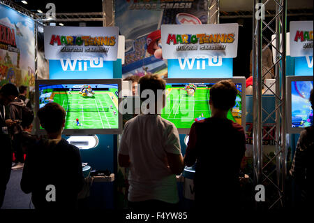 Warsaw, Poland. 24th Oct, 2015. Trade fair show games expo console Wii U stands, children playing Mario Tennis games at Warsaw Games Week, Targi Gier Wideo, Hala Expo XXI, Warsaw, Poland, October 24, 2015, horizontal orientation, rights managed, editorial use only. Credit:  Arletta Cwalina/Alamy Live News Stock Photo