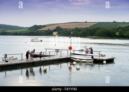 A family crabbing off a jetty at St Dogmaels, Pembrokeshire, Wales UK Stock Photo