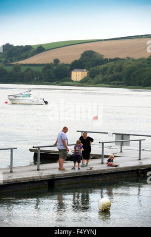 A family crabbing off a jetty at St Dogmaels, Pembrokeshire, Wales UK Stock Photo