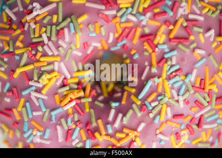 Heavily sugared iced bun Stock Photo