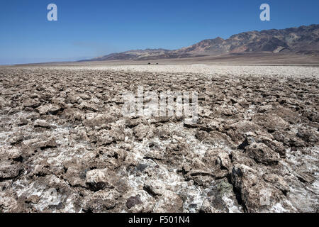 Salt structures on Devil's Golf Course, Panamint Range behind, Black Mountains, Death Valley National Park, Mojave Desert Stock Photo
