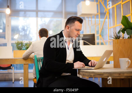 Coder working in office Stock Photo