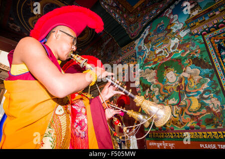 Young tibetean monks playing religious music in a Monastery near Boudnath Stupa Stock Photo