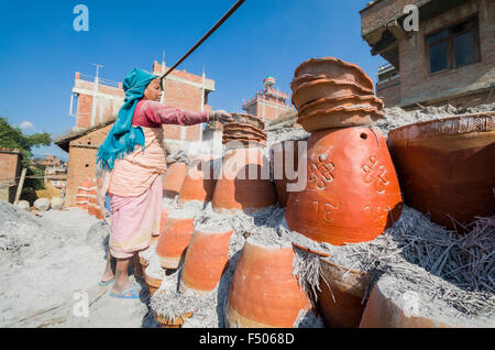 Worker sorting out pottery after the burning process Stock Photo