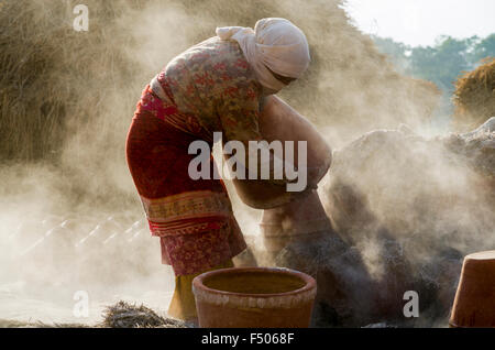 Worker sorting out pottery after the burning process Stock Photo