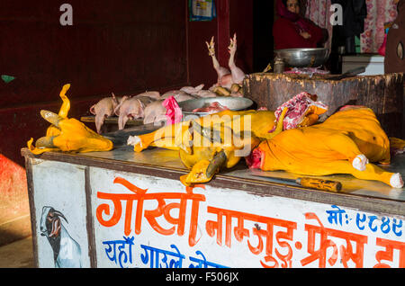 Chicken and goat bodies displayed for sale on the street Stock Photo