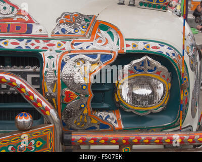 Details from an elaborate and artistically decorated colourful Bedford truck in Pakistani or Indian style, front hood Stock Photo