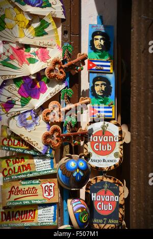 cheap gifts and souvenirs from Havana Cuba; fridge magnets, images of Che Guevara and the Cuban flag, hand painted fans etc Stock Photo