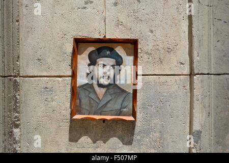 beautiful framed and signed portrait of Che Guevara nailed to a wall on a street in Old Havana Cuba Stock Photo