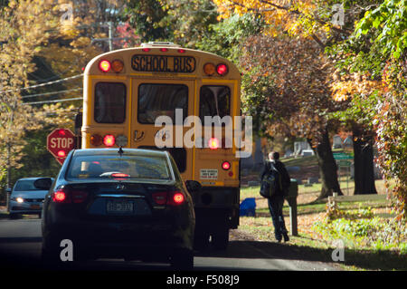 Schoolbus unloading student. Stock Photo