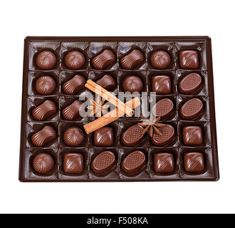 Assortment of chocolates in a plastic box close-up isolated on a white background. Stock Photo