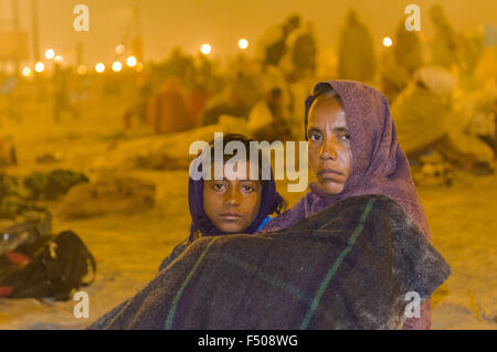 Millions of people gathering at Kumbha Mela ground, sitting and sleeping on the ground Stock Photo