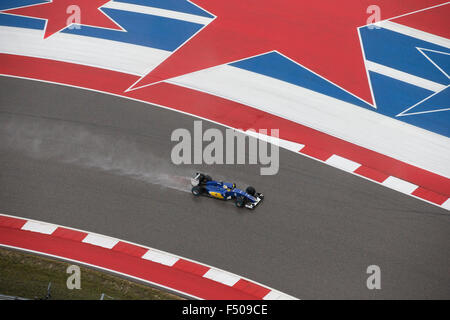 Austin, Texas USA October 25, 2015: Formula 1  driver Marcus Ericsson races in qualifying at a soaked Circuit of the Americas track in Sunday. Race officials are insistent on keeping Sunday's United States Grand Prix on schedule despite continued bad weather. Credit:  Bob Daemmrich/Alamy Live News Stock Photo