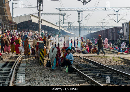 Many people waiting for delayed trains all over the railwaystation Stock Photo