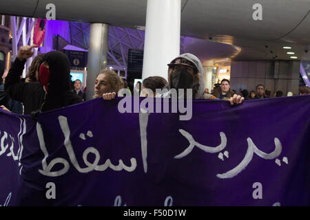 London, UK. 24th Oct, 2015. Protesters paraded a banner around King's Cross before facing off with police. Credit:  Louis Mignot/Alamy Live News Stock Photo